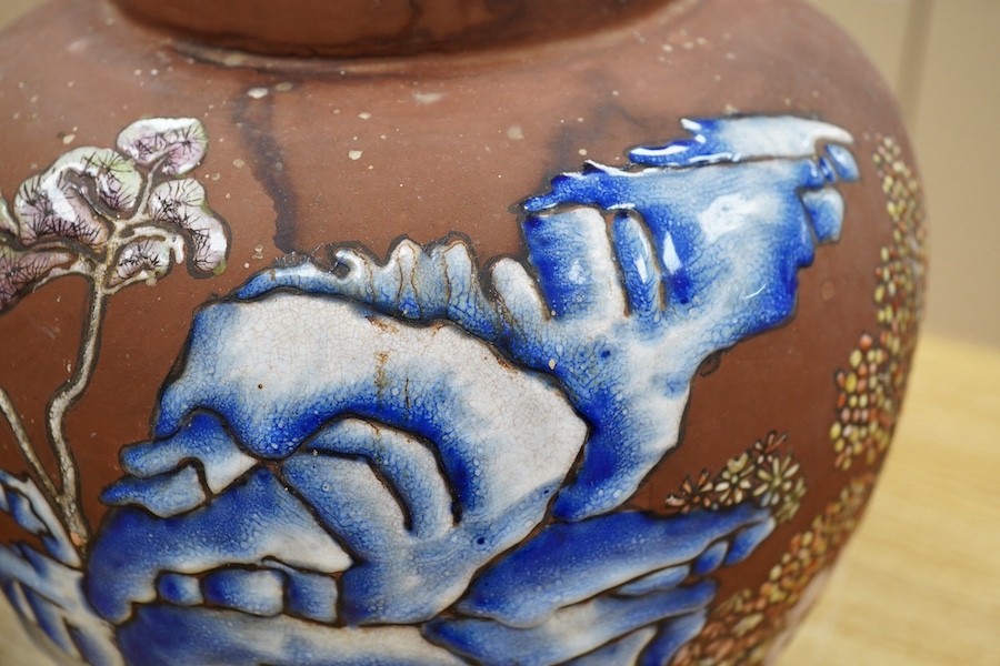 A pair of Japanese enamelled terracotta jars, c.1900, 26cm high. Condition - fair to good